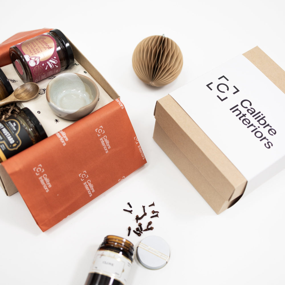 Custom-branded corporate gift hampers withCalibre Interiors logo and sustainable packaging and products