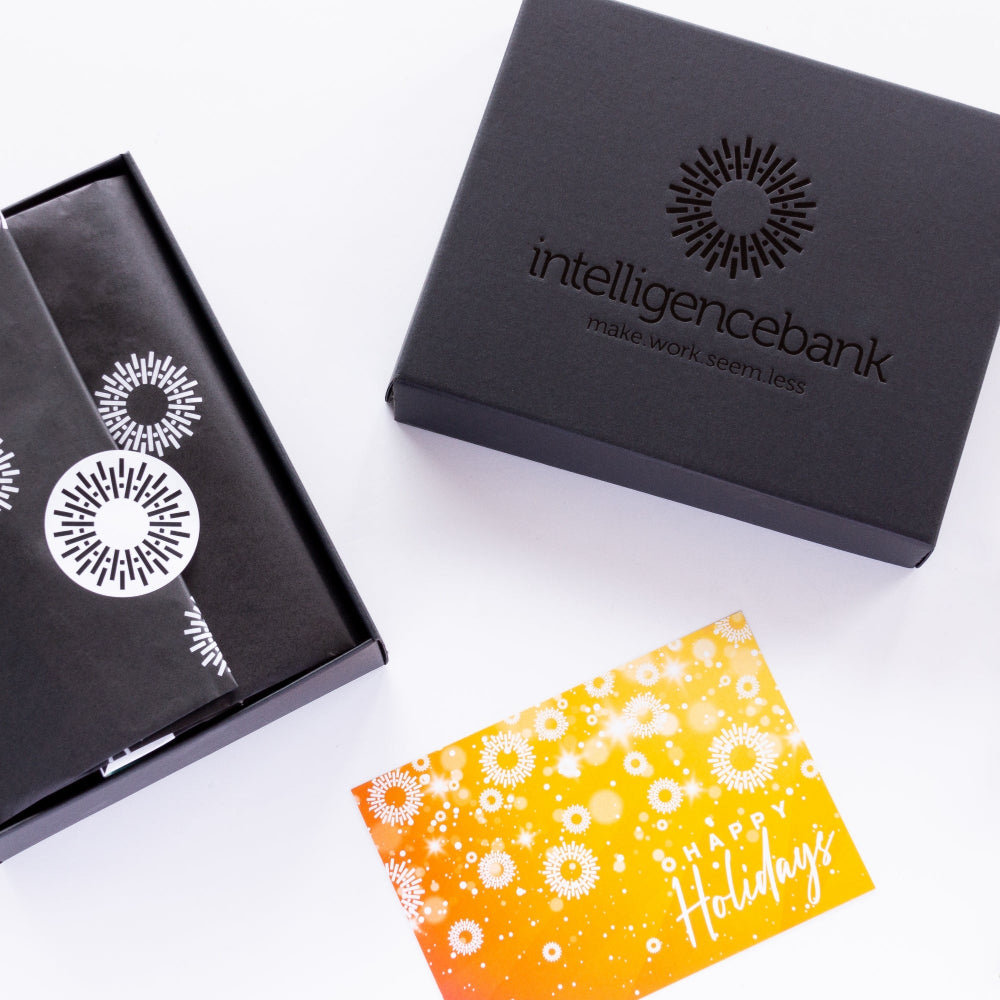 Custom-branded corporate gift hampers with Intelligence Bank logo and sustainable packaging for Christmas