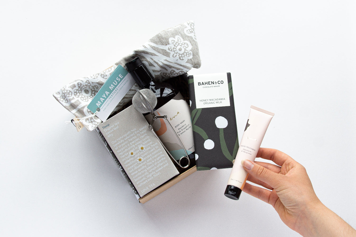 Bindle's pamper gift box including artisan bath salts, body lotion, and chocolate