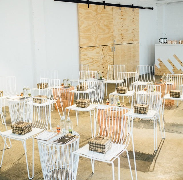 Bindle Event Custom Corporate Hamper Gift image with chairs and gift boxes