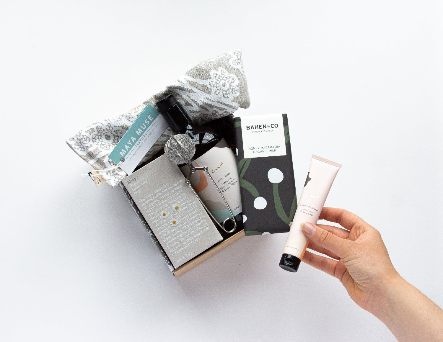 Bindle's pamper gift box including artisan bath salts, body lotion, and chocolate